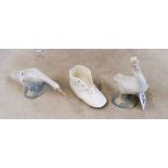 Two Lladro geese, a shoe match striker and two pink cups and saucers (a/f)