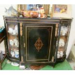 An ebonised credenza central glazed door and side glazed door (one foot deficient)