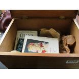 A small pine box with a group of reference books