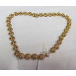 A gold coloured necklace