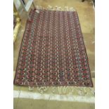 A vertical banded rug plaited tassels