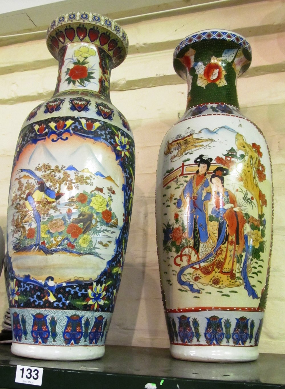 Two tall oriental style vases