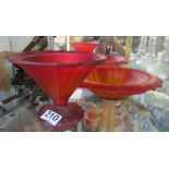 A red and yellow glass dish and a red glass vase