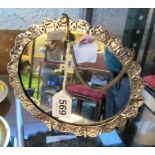 A white metal embossed mirror