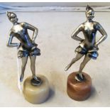 Two Art Deco figures ladies in frilled skirts on onyx bases