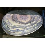 A large Victorian blue and white meat drainer dish, two other smaller meat plates and another plate