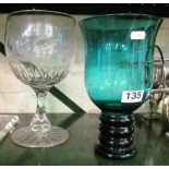 A large engraved glass goblet and green goblet