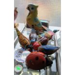 A tinplate clockwork Parrot, tinplate birds and a ladybird