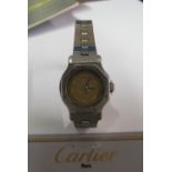 A Cartier Santos ladies stainless steel watch with octagonal surround to face, champagne dial (water