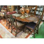 A reproduction mahogany twin pedestal dining table with interleaf and a set of early 20th Century