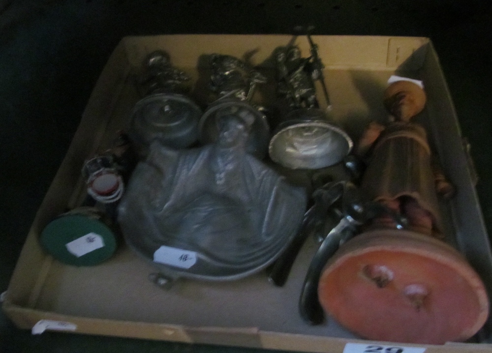 A metal dish geisha with umbrella, some military figures and pair of spurs