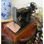 A Singer sewing machine (no lid)