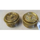 A pair of cast brass lidded boxes with liners