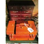 Three treen jewellery boxes one in the form of a sewing box and a swing mirror