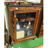 A pier cabinet with glass door