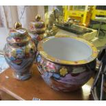 A gilt and floral oriental jardinière and a pair of matching lidded vases (1 a/f) decorated geisha