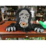 A gorilla mask and hands costume