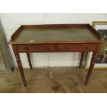 A Victorian mahogany desk with gallery and green leather top