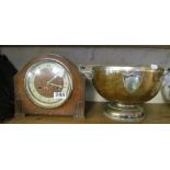 An oak mantel clock and an oak salad bowl with plated rim