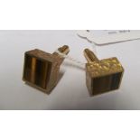 A pair of 9ct gold cufflinks set agate