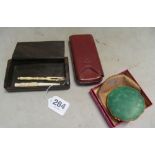 A leather cigar case, Kigu compact (boxed) and a carved box with two early 20th Century ivory items