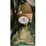 A brass cigarette box, brass inkwell and small barometer