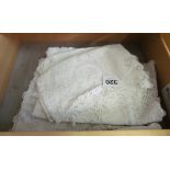 Various lace edged table and tray clothes