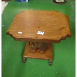 A teak table on elephant support