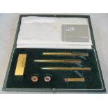 A Dunhill lighter, pen, cufflink and tie pin set (i.c)