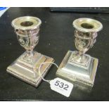 A pair silver dwarf candlesticks