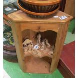 A small pine corner cupboard with scalloped shelf