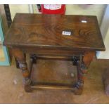 An oak joynt style stool on turned supports