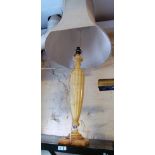 A tall alabaster lamp with silk shade