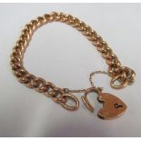 A 9ct gold bracelet with padlock clasp