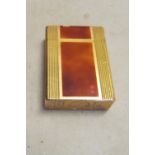 A Dupont lighter with gold-plated and tortoiseshell effect enamel panels