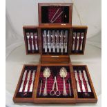 An unusual oak cabinet retailed A.G. Pailthorp containing twelve fruit knives and forks with