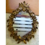 A decorative gilt mirror