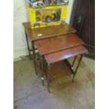 A nest of three mahogany occasional tables