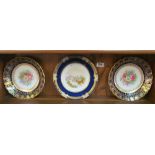 A pair of Copeland dishes handpainted flowers within blue and gilt borders and a Coalport plate with
