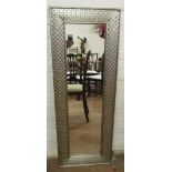 A silver painted framed mirror