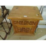 A pine bedside chest with drawer and cupboard