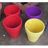 Four coloured garden pots