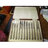 Twelve silver handled knives and six silver handled knives and forks
