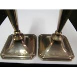 A pair of silver candlesticks