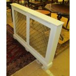 A white radiator cover with a double panel Regency diamond design grill 49"l x 35"h x 6"d