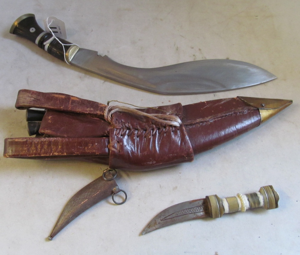 A dagger in a leather holster signed military with two small daggers and a small mother of pearl - Image 3 of 4