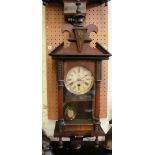 A small mahogany wall clock