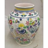 A large Poole Pottery vase brightly coloured pattern of deer amongst flowers