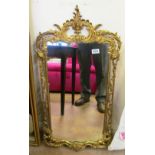 A pair of decorative brass mirrors