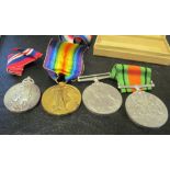 A WWI peace medal, two WWII medals and a 1953 cornonation metal